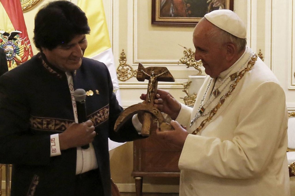 Bolivian President Evo Morales presents Pope Francis with a crucifix incorporating the hammer and sickle symbol during a meeting at the presidential palace in La Paz. Photo: Juan Carlos Usnayo/Agence France-Presse/Getty Images 