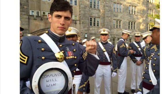 West Point Alumnus Holding A Pro-Colin Kaepernick “Communism Will Win” Sign While In Uniform