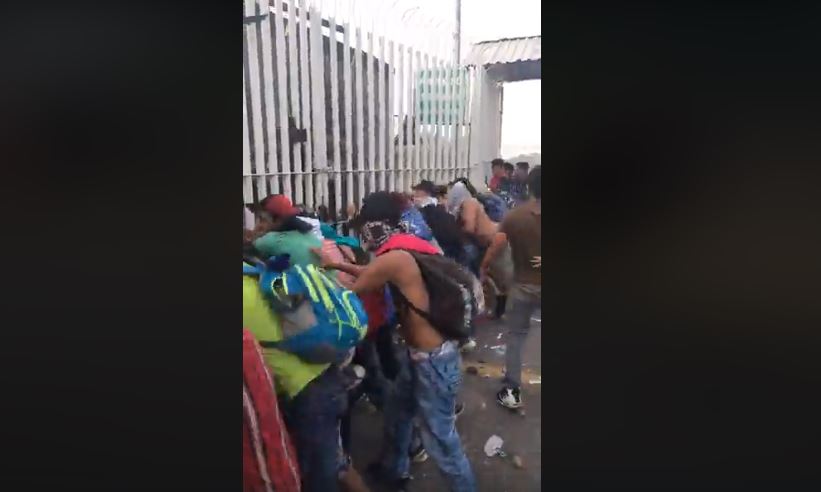WATCH: Chaos as ‘Migrants’ Destroy Gate at Mexico’s Southern Border